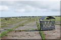 SM7825 : Cattle feeders on the abandoned runway at St David's by Simon Mortimer