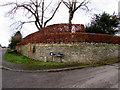 Hedge and stone wall on a Fulbrook corner, West Oxfordshire