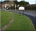 Signs alongside a bend in the B4262 Heol Isaf, Radyr, Cardiff