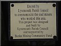 NZ2990 : Plaque on pit wheel, Lynemouth by Graham Robson