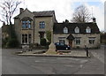 Meadow Lane houses behind Fulbrook War Memorial, West Oxfordshire