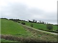 Private farm lane ascending a drumlin slope east of the A22