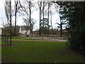 Entrance to dog activity area with new houses in background