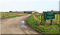 Farm access road leaving High Lane