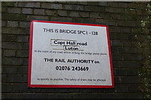 TL1118 : Copt Hall Road Railway Bridge sign by Geographer