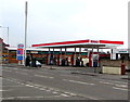 SJ3168 : Esso filling station and a telecoms mast, Queensferry by Jaggery