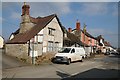 Timber-framed cottage with scaffolding