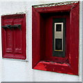 Disused stamp machines in the wall of Pembrey Post Office