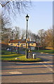 SE2489 : Guide stone and lamppost at road junction by Roger Templeman