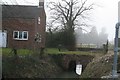 Brick arched bridge over a drain alongside the B1200 at Saltfleetby St. Peter