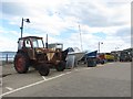 TA1280 : Tractor and boats, Coble Landing, Filey by Graham Robson