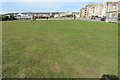 Open grass area on the sea front