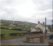 J2733 : Houses and Wind Turbine at The Square, Kilcoo by Eric Jones