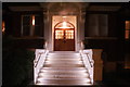 View of the steps of Aubrey House illuminated from Maida Avenue