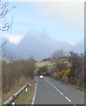 The A25 skirting the shores of Lough Island Reavy Reservoir