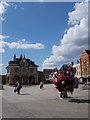 TL1998 : Balloon seller on Cathedral Square, Peterborough by Paul Bryan
