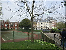 SY6990 : West Walks tennis court and Hascombe Court by John Stephen