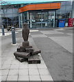 Wooden owl and books outside Paignton Library and Information Centre