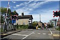 Cyclists cross the railway on Lodge Lane