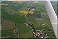 Ridge and furrow and old ditch lines between dismantled railway and Main Street, Trusthorpe: aerial 2018