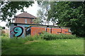 View of graffiti on a shed in the Roding Valley Nature Reserve by Roding Lane