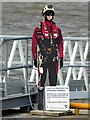 Safety mannequin beside the pier