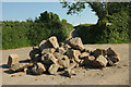 SX7640 : Rocks in the road near Halwell House by Derek Harper