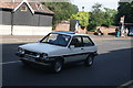 View of a Ford Fiesta XR2 waiting at the traffic lights at Eltham Church on Well Hall Road