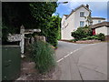 Signpost and house in Yeoford