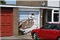 View of a street art wigeon on the door of a garage on Waterside, off Coppermill Lane