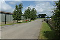 TL9990 : Entrance Road at Hall Farm Horse Rescue Centre by Geographer