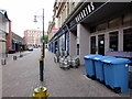 Kegs and wheelie bins outside Hogarths, Cambrian Road, Newport