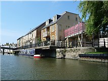 TL5479 : Riverside buildings with a cantilevered pavement, Ely by Christine Johnstone