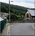 Black bench at a bend in School Street, Deri