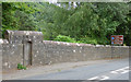 A gate in the wall beside Irvine Road