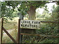 TL8327 : Lodge Farm sign by Geographer