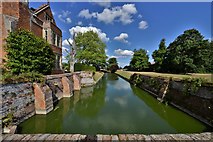 TL8647 : Long Melford, Kentwell Hall: The moat by Michael Garlick
