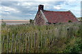 Old building overlooking Budle Bay