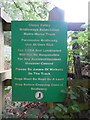 TQ0197 : Green Notice Board by railway bridge by David Hillas