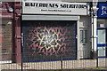 View of a mural on the shutter of Waterdenes Solicitors on Brockley Road