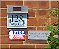 Number and signs on 128 Dalby Road