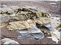 Colourful rocks on Amble beach