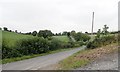 Drumalt Road ascending north-eastwards to the junction with Slatequarry Road