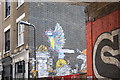 View of street art on the side of a building on Rivington Street