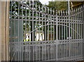 A gatehouse with glass and spikes