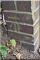 Benchmark on wall near tunnel of Oakley Road subway