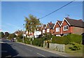 Cowfold: semi-detached houses by the A281