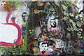 View of street art amongst the brambles at the end of Leake Street Arches