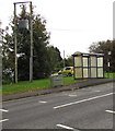 Line spur pole near an A4061 bus stop and shelter, Bryncethin