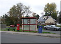 Elizabeth II postbox and bus stop on Pope Lane, White Stake